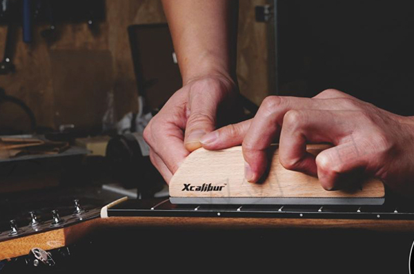 Fret leveling and height correction